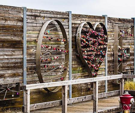 LOVE sign with padlocks at the harbour of List